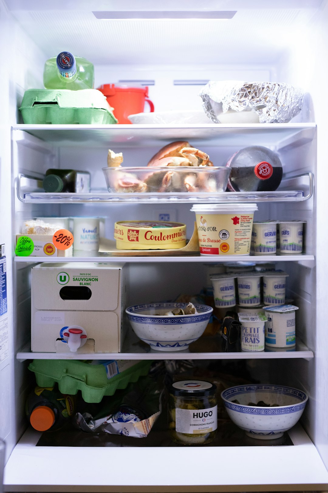 an-open-refrigerator-filled-with-lots-of-food-3a0qrjoesx4